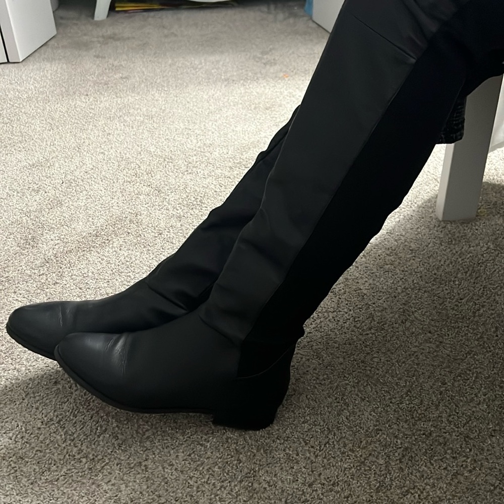 black thigh high boots.